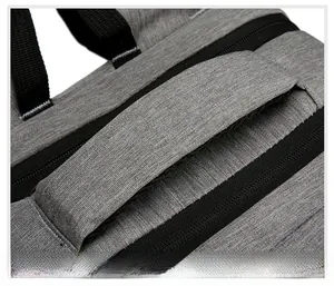 Detail of the thickened padded handle on the gray waterproof laptop backpack fabric