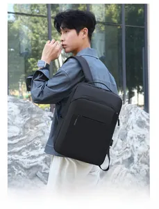 Outdoor shot of a premium black waterproof 16-inch laptop backpack with wide straps