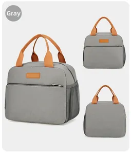 Sac isotherme gris avec poignées orange comprenant une poche latérale et une poche zippée