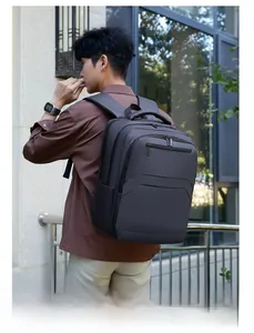 Outdoor side view of a waterproof business backpack with ergonomic straps and side pockets