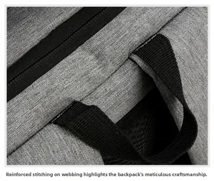 Detail showing reinforced stitching on the grey fabric handle of the 16 inch laptop backpack