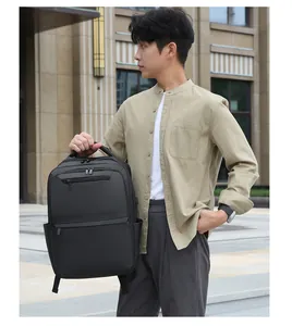 Close-up of black waterproof business backpack with external USB port and side handle