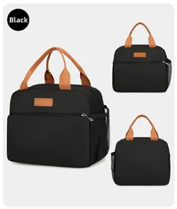 Vue détaillée du sac isotherme noir avec poche filet latérale et poignées brunes