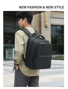 Close-up of the breathable padded shoulder straps and durable handle on a black travel backpack