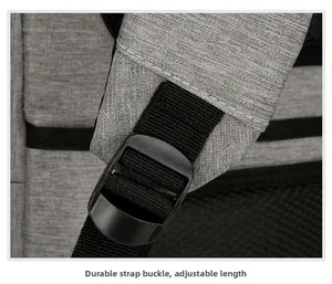 Close-up of sturdy buckle and adjustable shoulder strap on grey business backpack