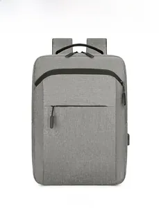 Detailed front view of grey water-resistant laptop backpack with dual zipper pockets