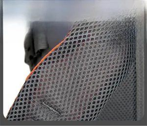 Close-up of thick honeycomb mesh shoulder straps on a durable hiking backpack