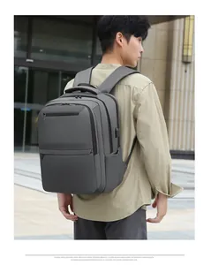 Detail of grey waterproof laptop backpack with external USB charging port for travel