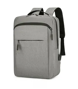 Side view of gray laptop backpack showing waterproof fabric and external USB charging port