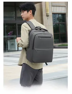 Deep gray expandable business laptop backpack with multiple zipper pockets for travel