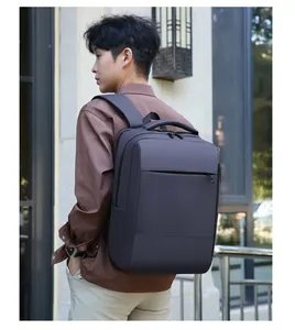 Detail of dark grey business backpack with matte waterproof fabric and ergonomic straps