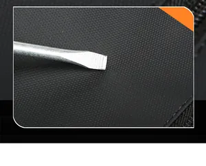 Macro detail of scratch-resistant black fabric with high-density grain on a laptop backpack