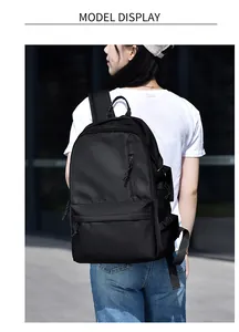 Outdoor model display of a black waterproof backpack with large capacity and durable nylon