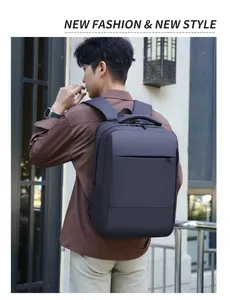 Deep grey business laptop backpack with waterproof matte fabric shown in a street setting