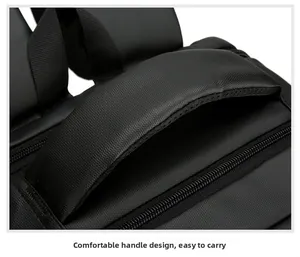 Detail of padded top handle with breathable mesh and reinforced stitching on black backpack