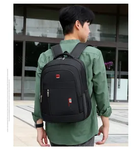 Detailed view of black multi-pocket travel backpack featuring sport fashion logo branding