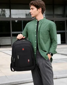 Close-up of durable black fabric and red sport logo on spacious travel backpack