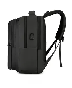 Side view of black business backpack showing USB charging port and zipper layers
