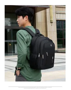 Outdoor shot of a black waterproof business backpack with ergonomic padded shoulder straps
