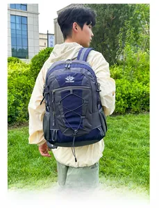 Side view of a blue large capacity hiking backpack with mesh pockets on a male model