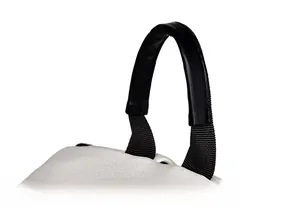 Close-up of a rounded ergonomic handle on a waterproof backpack with durable fabric