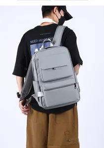 Gray large capacity laptop backpack showing magnetic flap pocket and side pocket detail