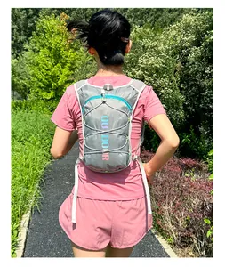 Detail of grey hydration running backpack with outdoor lettering and mesh straps