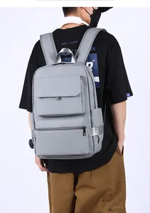 Rear view of grey water-resistant business laptop backpack with multiple pockets