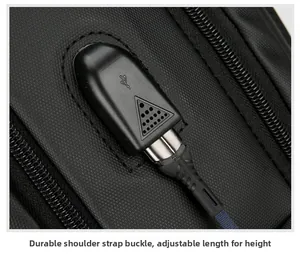 Detail of the external USB charging port on the durable black business laptop backpack