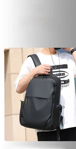 Detail of minimalist black water-resistant business backpack with yellow contrast zipper