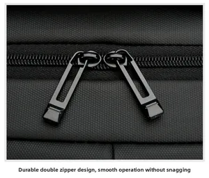 Close-up of durable dual metal zippers on water-resistant black nylon business backpack