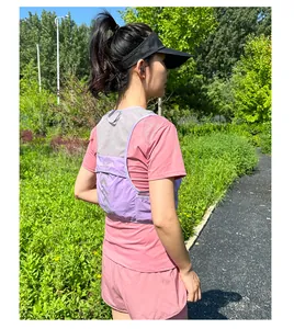 Detail view of purple lightweight mesh running vest with reflective patterns and pockets