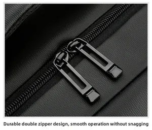 Macro detail of a durable double-zipper on a black textured nylon laptop backpack
