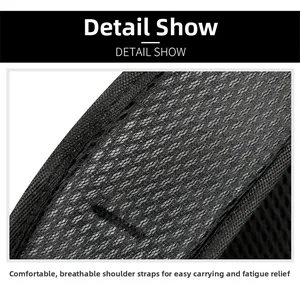 Detail of breathable honeycomb mesh shoulder straps on a black travel backpack