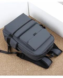 Close-up of dark grey backpack featuring waterproof fabric and padded shoulder straps