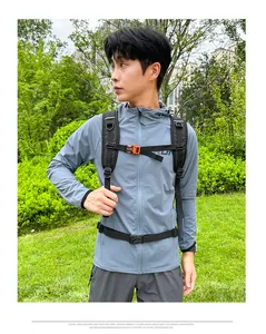 Outdoor backpack with adjustable straps and chest buckle shown in forest setting