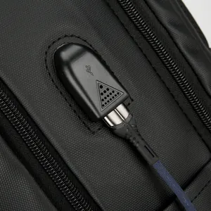 Men's business laptop backpack featuring a high-speed external USB charging port and cable