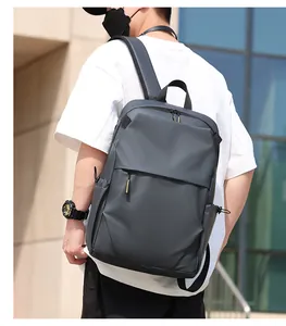 Close-up of dark grey business backpack with ergonomic straps and water-resistant fabric