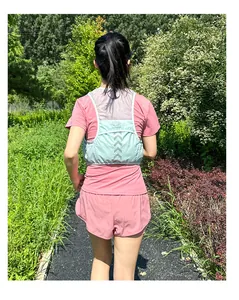 Breathable outdoor running vest in mint green with reflective stripes and mesh fabric detail