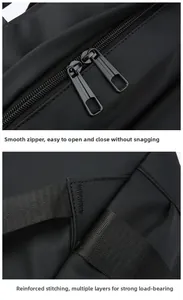 Detail of durable dual metal zippers and reinforced stitching on black travel backpack