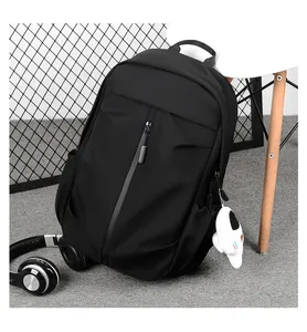 Macro detail of casual black waterproof nylon backpack with front zipper and side pocket