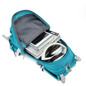 Deep blue nylon sports backpack main compartment showing storage for tablet and headphones