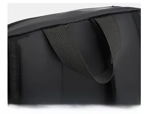 Detail of reinforced nylon top handle and waterproof fabric on black business backpack