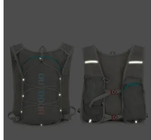 Macro view of gray hydration vest showing 360 reflective strips and breathable mesh fabric