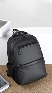 Close-up of black water-resistant business backpack with multi-layer zipper compartments