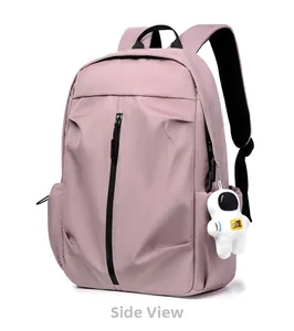 Side view of pink nylon backpack with vertical zipper detail and astronaut plush toy