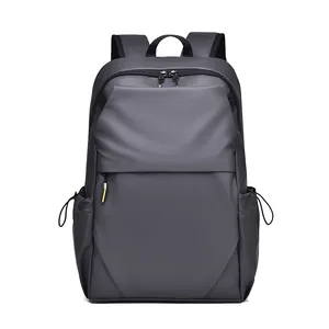 Deep grey minimalist business laptop backpack with water-resistant fabric and yellow accents