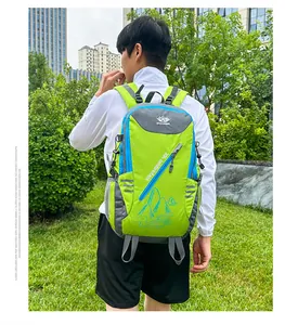 Side view of a bright green and grey hiking backpack with wide padded shoulder straps