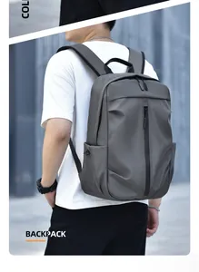 Detail of dark grey waterproof backpack featuring a modern vertical zipper and side pocket