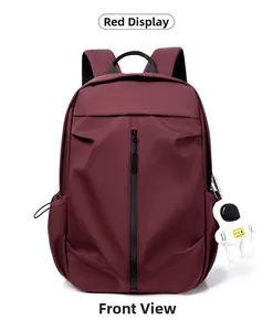 Front view of the red nylon sports backpack with vertical zipper and astronaut pendant